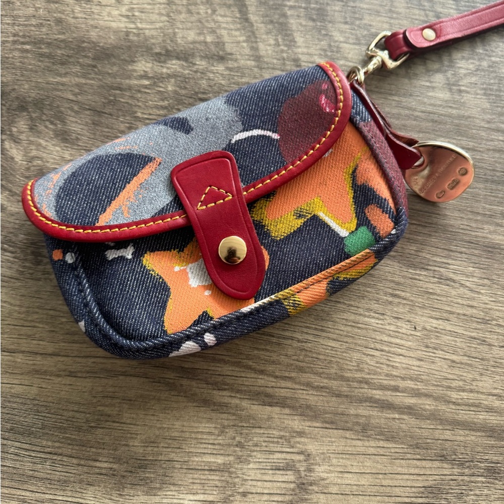 Dooney & Bourke denim with red Leather trim Wallet with Artistic Design